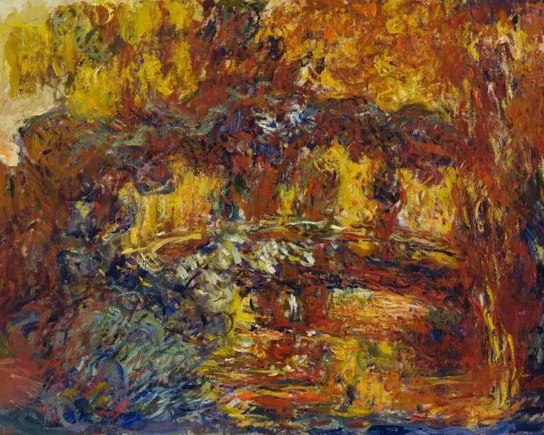 Pintura de Claude Monet de cerca de 1920 a 1922: a mesma ponte quase se desfaz em pinceladas grossas de vermelho, castanho e amarelo, sem contornos definidos